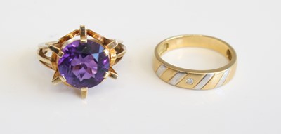 Lot 296 - An 18ct yellow gold wedding band, set with a...