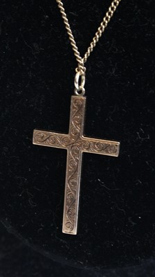 Lot 318 - A 9ct gold cross pendant on 9ct gold neck...