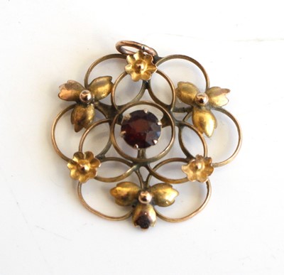 Lot 325 - An Edwardian 9ct gold and garnet set openwork...