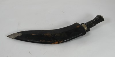 Lot 473 - A 20th century kukri, having a curved 11"...