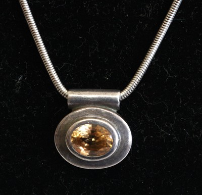 Lot 331 - A silver and quartz pendant on silver snake...