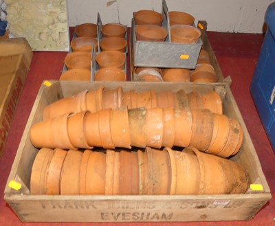 Lot 1068 - A collection of terracotta garden plant pots,...