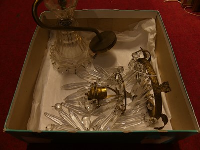 Lot 1070 - A gilt metal wall light, having faceted glass...