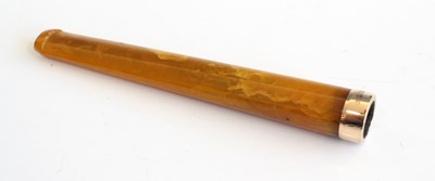 Lot 375 - A leather cased amber and 15ct gold tipped...