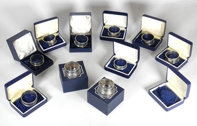 Lot 418 - A collection of Elizabeth II silver napkin...