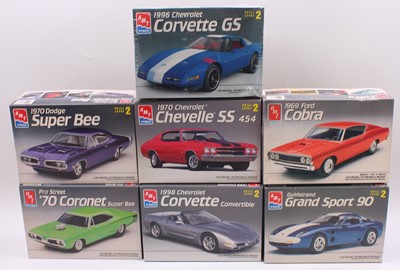 Lot 656 - A collection of seven boxed AMT/Ertl 1/25...
