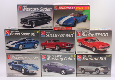 Lot 678 - A collection of eight boxed AMT/Ertl 1/25...