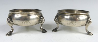 Lot 2089 - A near-pair of George II silver table salts,...
