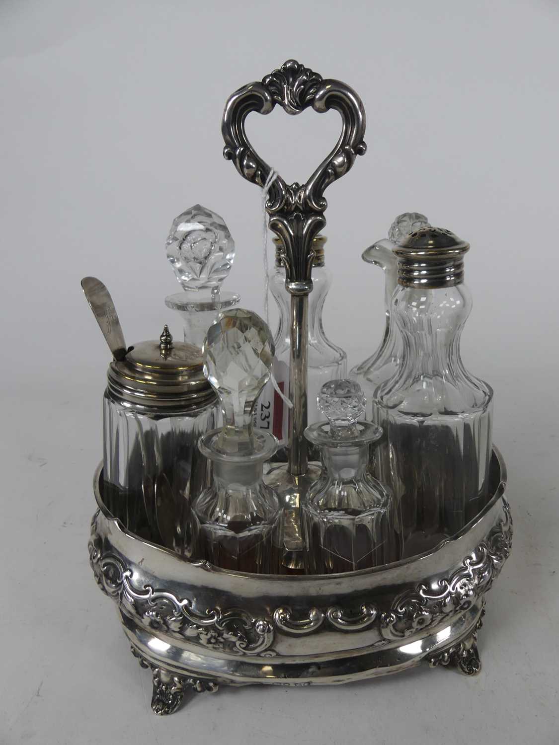 Lot 2076 - A Victorian silver cruet stand with associated...