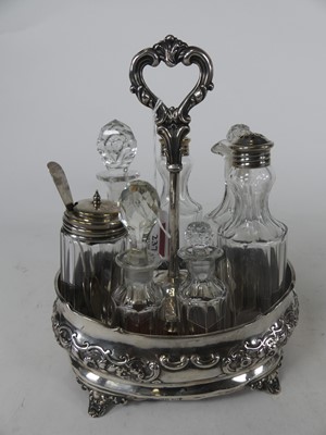 Lot 2076 - A Victorian silver cruet stand with associated...