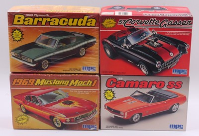 Lot 693 - Four boxed MPC 1/25 scale plastic vehicle kits...