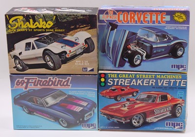 Lot 699 - Four boxed MPC 1/20 and 1.25 scale plastic car...