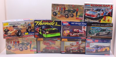 Lot 704 - Ten boxed Monogram mixed scale plastic car...