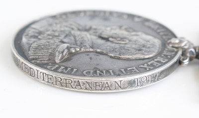 Lot 3331 - A Naval group of four medals to include...