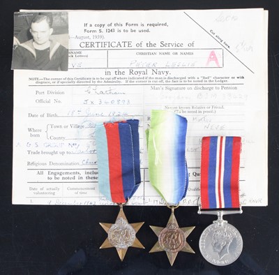 Lot 3294 - A group of three WW II medals to include...