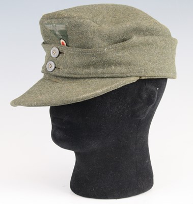 Lot 3052 - A German Third Reich M43 pattern Feldmütze, in...