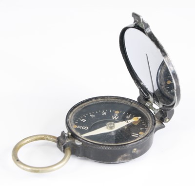 Lot 3061 - A German black lacquered marching compass, the...