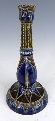 Lot 6 - A Doulton Lambeth stoneware candlestick, the...