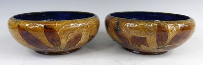Lot 9 - A pair of Royal Doulton glazed stoneware...