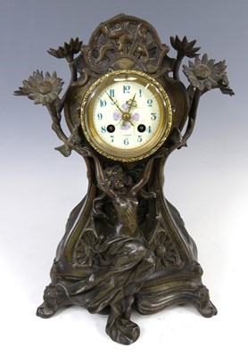 Lot 174 - An Art Nouveau patinated spelter mantel...