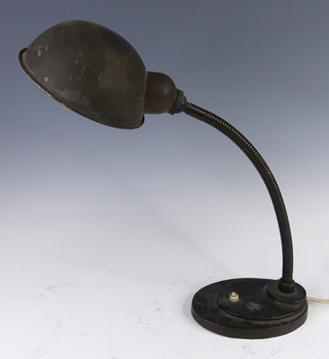 Lot 181 - An Art Deco brass desk lamp, the domed shade...