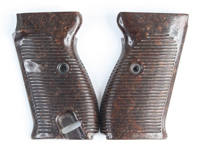 Lot 3087 - A pair of brown bakelite pistol grips for a...