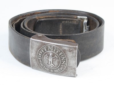 Lot 3124 - A German Third Reich brown leather belt, the...