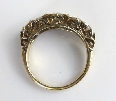 Lot 2100 - A yellow metal diamond half eternity ring,...