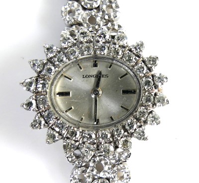 Lot 2137 - A white metal lady's diamond set Longines...
