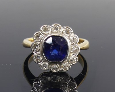 Lot 2104 - A yellow and white metal, sapphire and diamond...