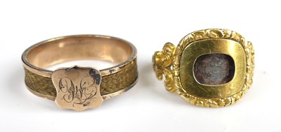 Lot 2120 - Two mourning rings, being a rose metal 5.5mm...