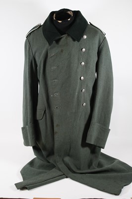 Lot 3204 - A German Third Reich M40 great coat, the full...