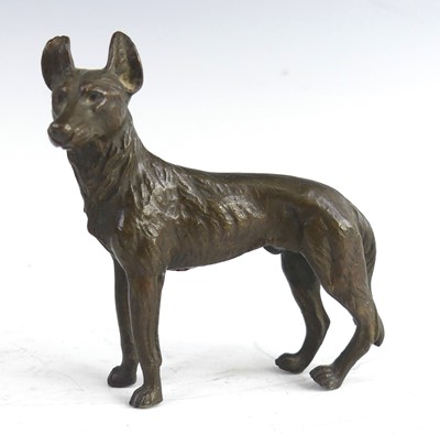 Lot 2166 - A miniature patinated bronze figure of a...