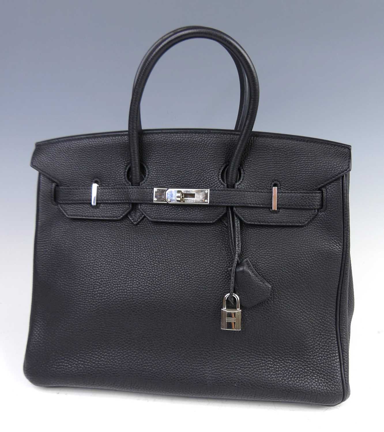 Lot 156 - Hermès - a Birkin 35 black leather handbag,...