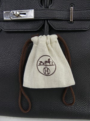 Lot 156 - Hermès - a Birkin 35 black leather handbag,...