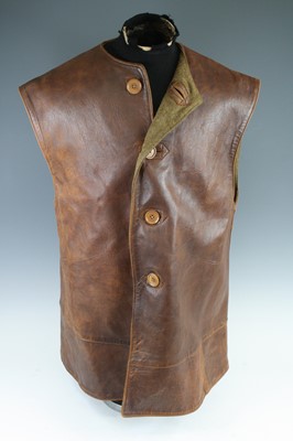 Lot 3290 - A WW II brown leather jerkin bearing an...