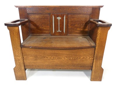 Lot 355 - An Arts & Crafts oak settle, having pierced...