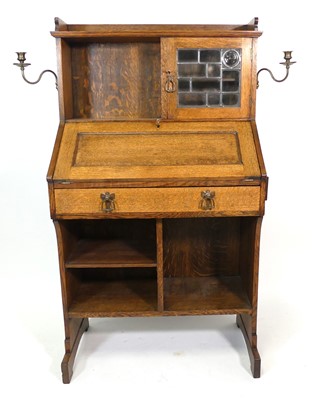 Lot 357 - An Arts & Crafts oak student's combination...