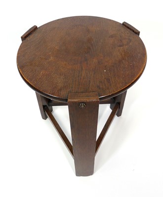 Lot 351 - An Arts & Crafts oak circular occasional table,...