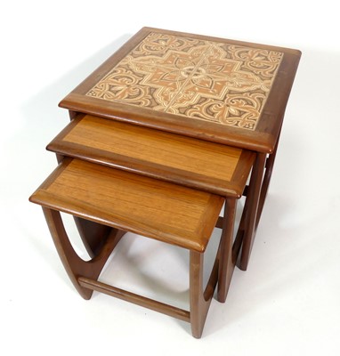 Lot 370 - A 1960s G-Plan teak and tile-top inset nest of...