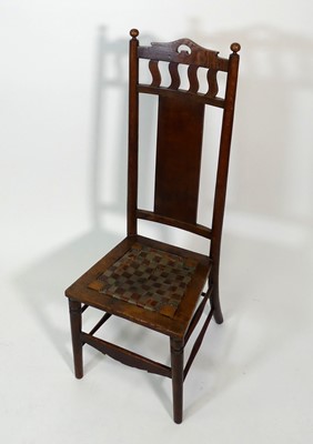 Lot 353 - An Arts & Crafts oak nursing chair, having...
