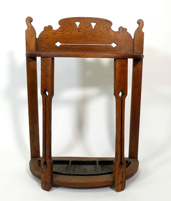 Lot 354 - An Arts & Crafts oak demi-lune twin division...