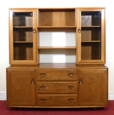 Lot 401 - An Ercol blond elm 'Windsor' side cabinet, the...