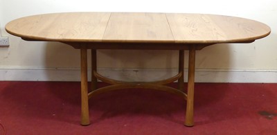 Lot 398 - An Ercol blond elm D-end extending dining...