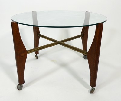 Lot 389 - A 1960s circular clear glass topped coffee...