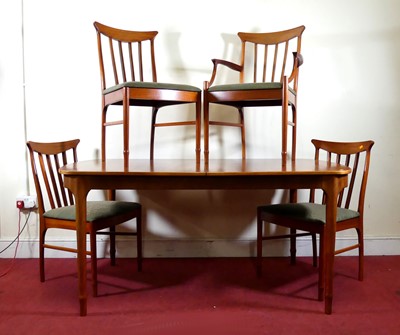 Lot 375 - A 1960s teak dining suite by A.H. McIntosh Ltd,...