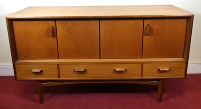 Lot 368 - A 1960s G-Plan teak compact sideboard, having...