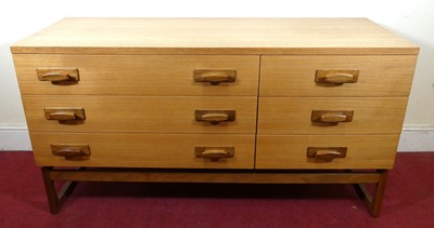 Lot 385 - A 1960s teak low long side chest, fitted with...