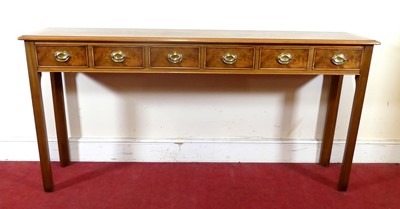 Lot 2330 - A walnut and figured walnut hall table, having...