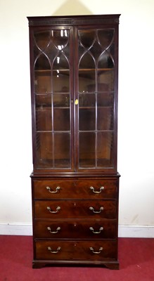 Lot 2322 - A George III mahogany secretaire bookcase, of...